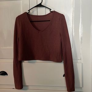 Redwood colored crop-top long sleeve. Didn’t come with tags and never worn.